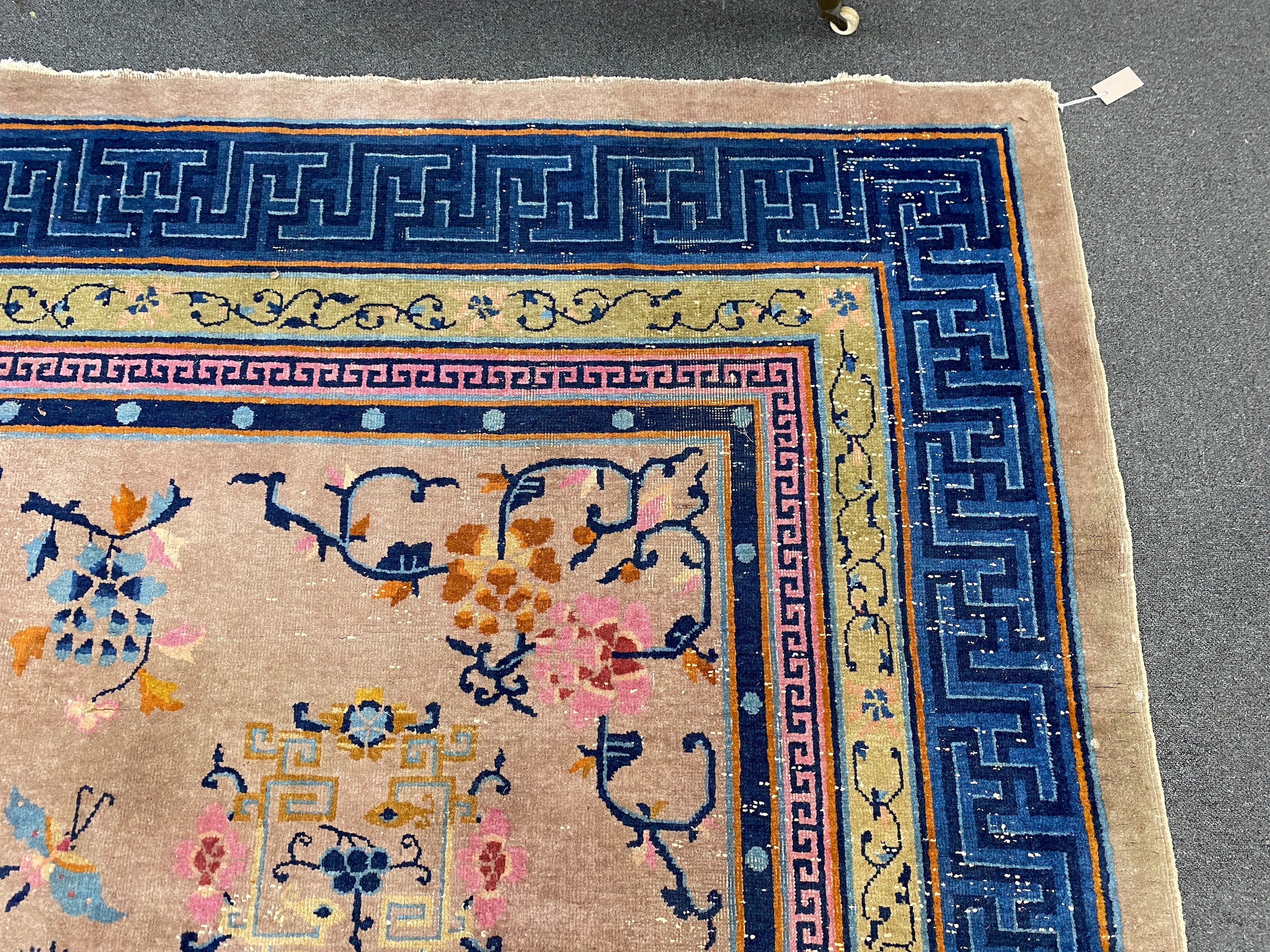 An early 20th century Chinese lilac ground carpet, 330 x 240cm